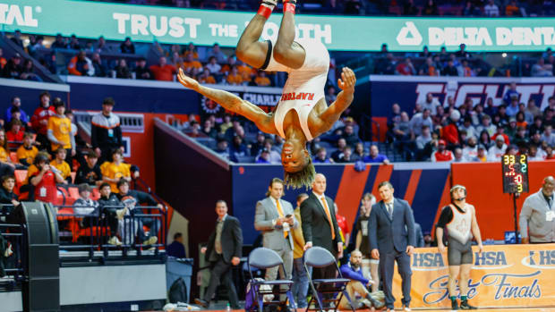 Rich Township's Nasir Bailey does a flip after winning the Illinois Class 3A wrestling championship at 138 pounds.